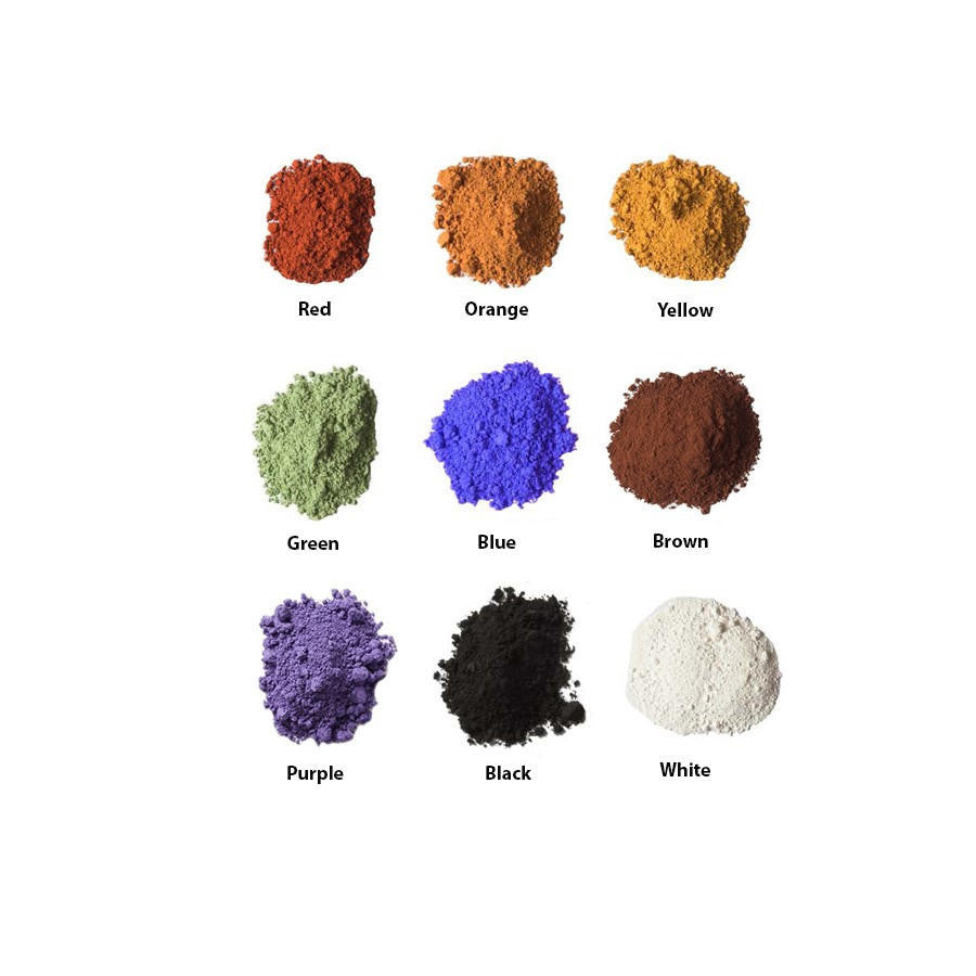 Samples, in small piles, of the nine colors of Natural Earth Paint; red, orange, yellow, green, blue, brown, purple, black and white