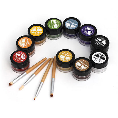 Jars of all ten colors of face paint arranged artistically  with four makeup applicators