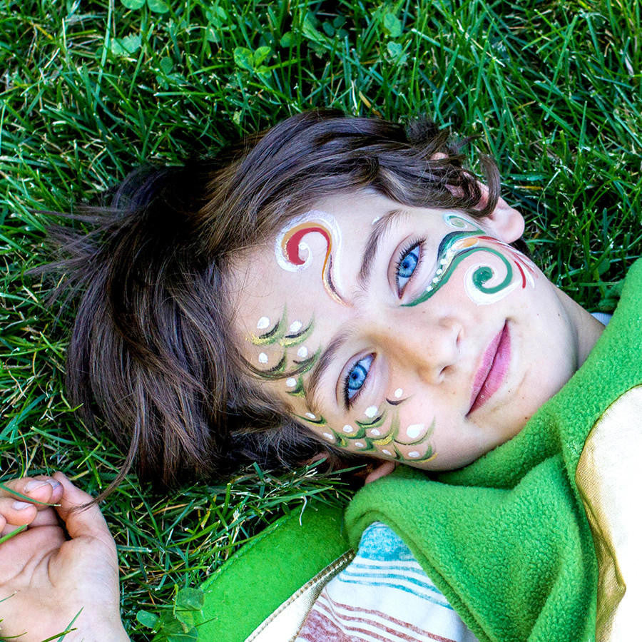 A young boy with painted face