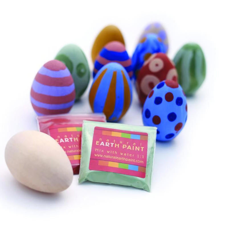 Examples of painted wooden eggs with two color packets and an uncolored wooden egg